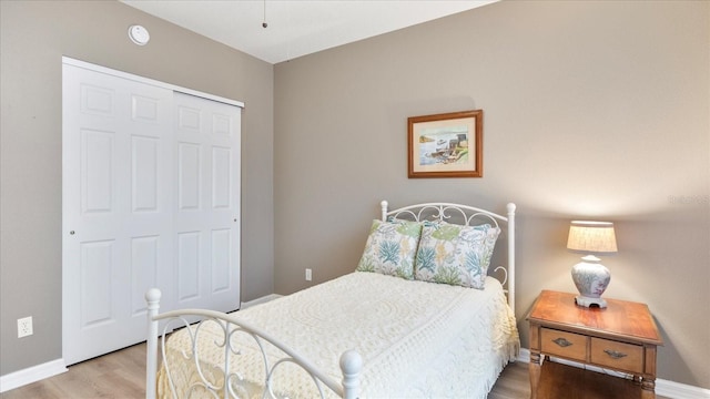 bedroom featuring a closet and light hardwood / wood-style floors