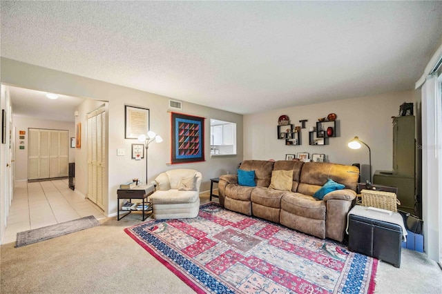 living room with light colored carpet and a textured ceiling