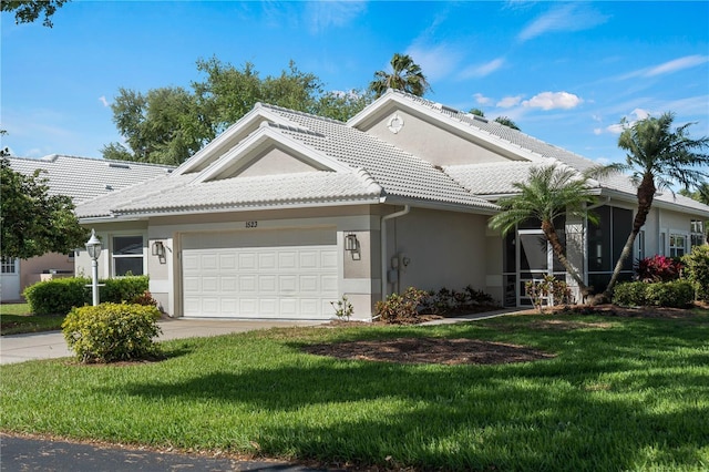 view of front facade with a front lawn and a garage