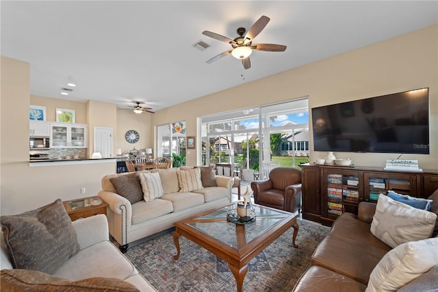 living room with ceiling fan