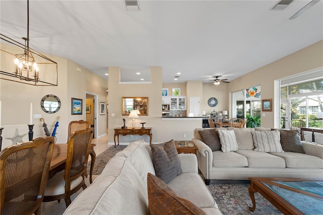 living room featuring a notable chandelier