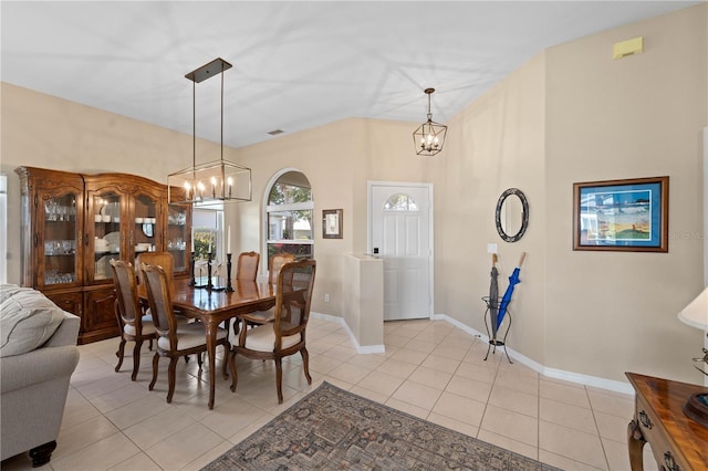 dining area featuring light tile patterned floors and a chandelier