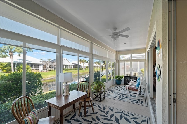 sunroom featuring ceiling fan