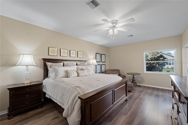 bedroom featuring ceiling fan and dark hardwood / wood-style floors