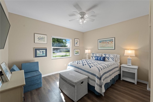 bedroom with ceiling fan and dark wood-type flooring