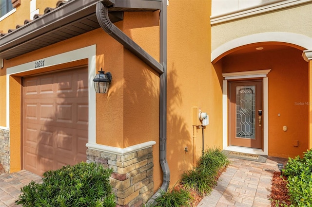 entrance to property featuring a garage