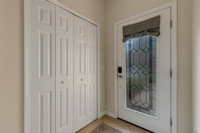 entryway with light tile patterned floors