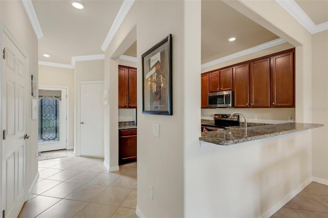 kitchen with kitchen peninsula, appliances with stainless steel finishes, stone countertops, and light tile patterned flooring