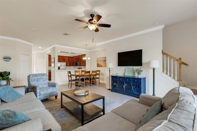 tiled living room with ceiling fan and ornamental molding