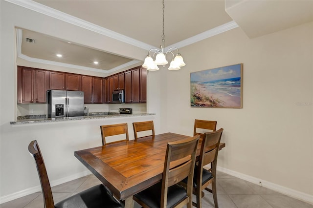 tiled dining room with crown molding, sink, and an inviting chandelier