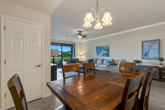 tiled dining area with ceiling fan with notable chandelier and crown molding