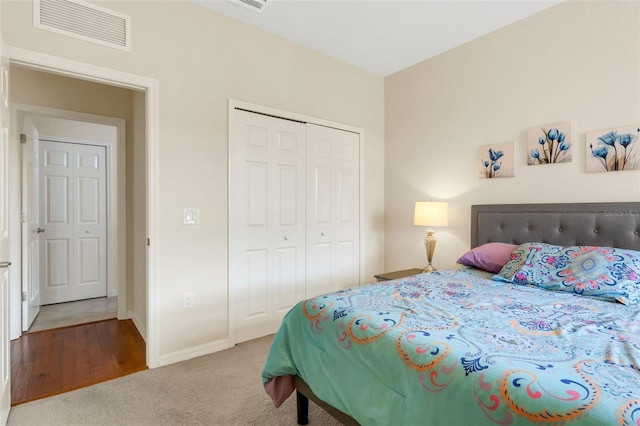 bedroom with carpet and a closet