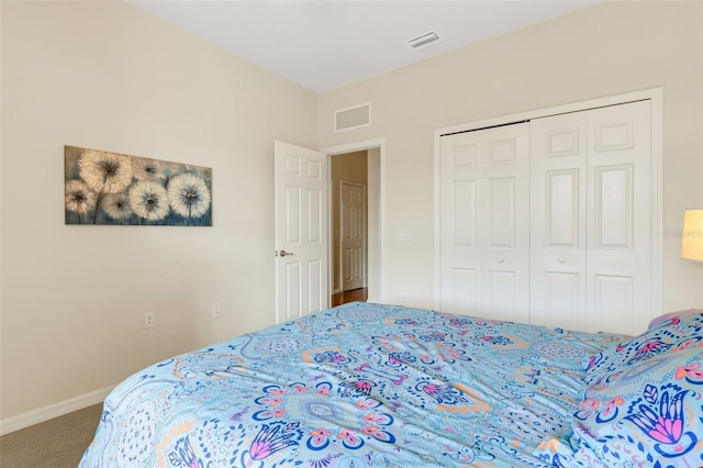 carpeted bedroom featuring a closet