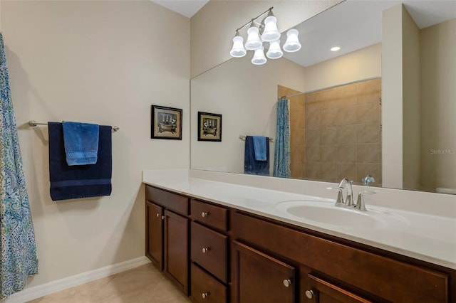 bathroom featuring walk in shower, tile patterned floors, and vanity