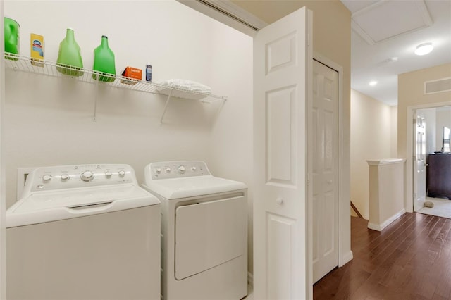 laundry area featuring dark hardwood / wood-style floors and independent washer and dryer