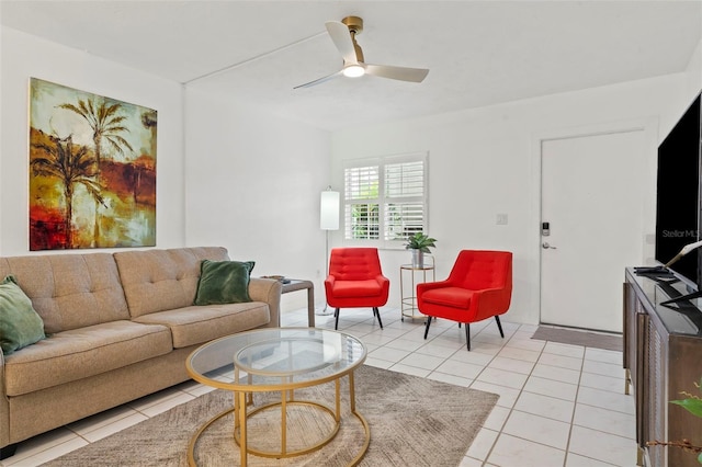 living room with ceiling fan and light tile patterned floors