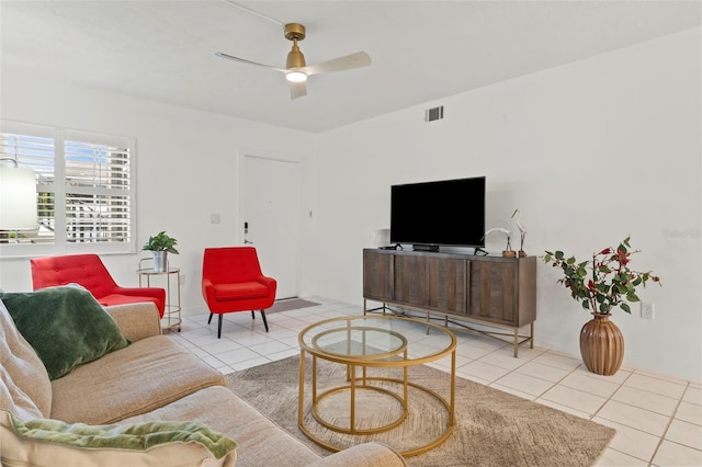 tiled living room with ceiling fan