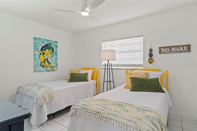 tiled bedroom with ceiling fan