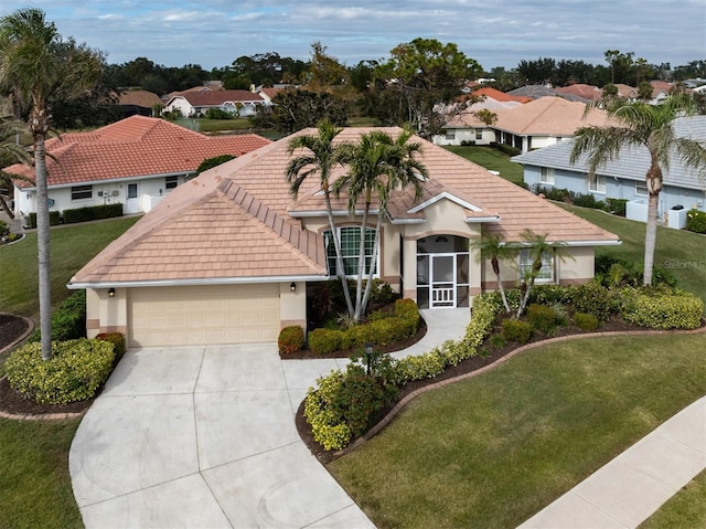 view of front of home featuring a garage and a front yard