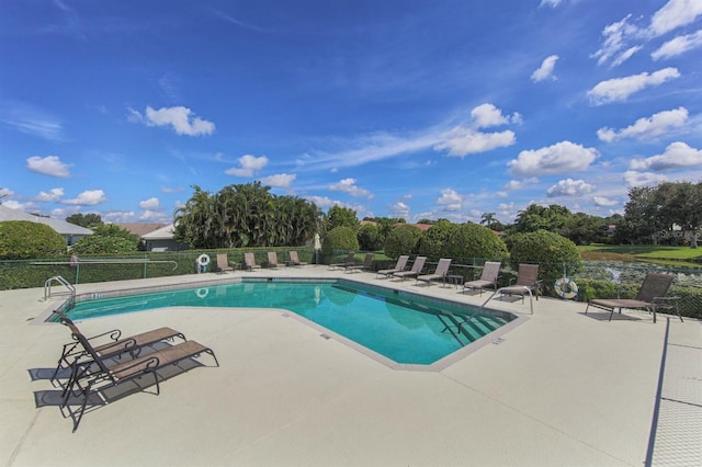 view of swimming pool with a patio area