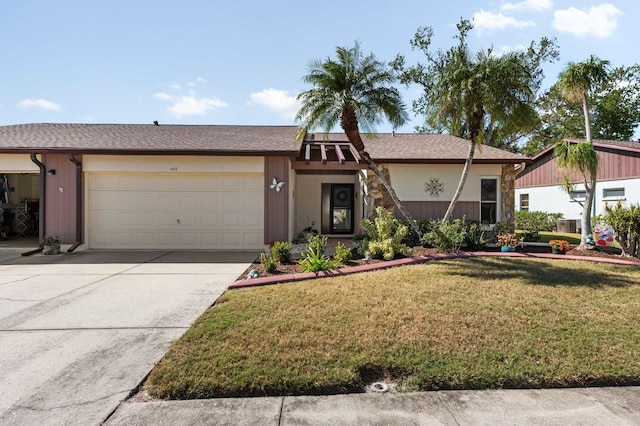 single story home with a garage and a front yard