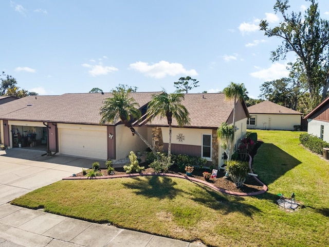 ranch-style home featuring a garage and a front yard