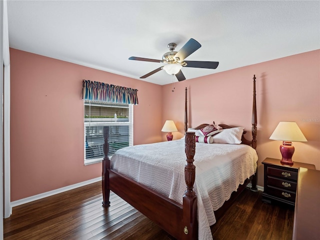 bedroom featuring ceiling fan and dark hardwood / wood-style floors