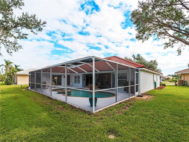 view of swimming pool featuring glass enclosure, a lawn, and a patio