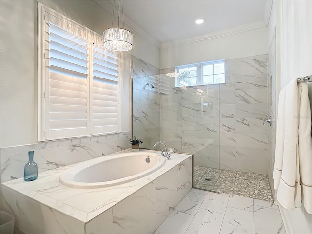 bathroom featuring ornamental molding and independent shower and bath