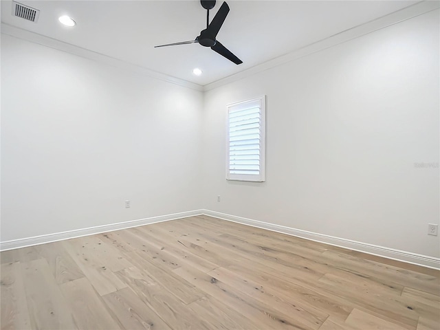 unfurnished room with crown molding, light hardwood / wood-style floors, and ceiling fan