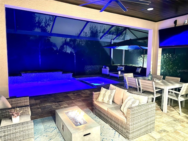 view of patio / terrace featuring an outdoor living space with a fire pit and ceiling fan