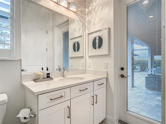 bathroom with vanity and toilet