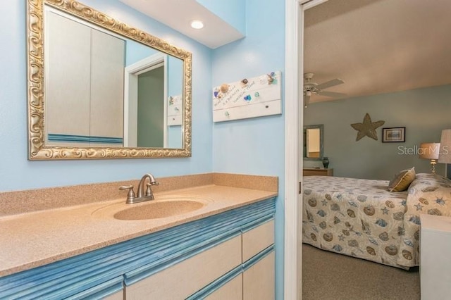 bathroom featuring ceiling fan and vanity