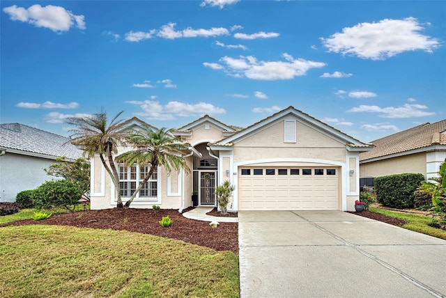 ranch-style home with a front yard and a garage