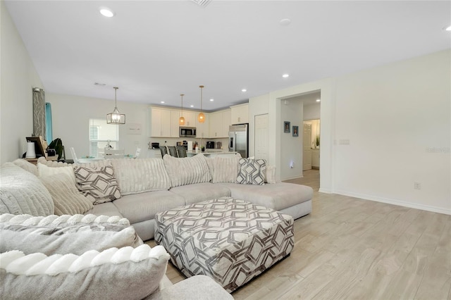 living room with light hardwood / wood-style floors