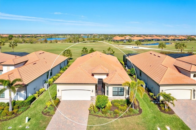 birds eye view of property with a water view