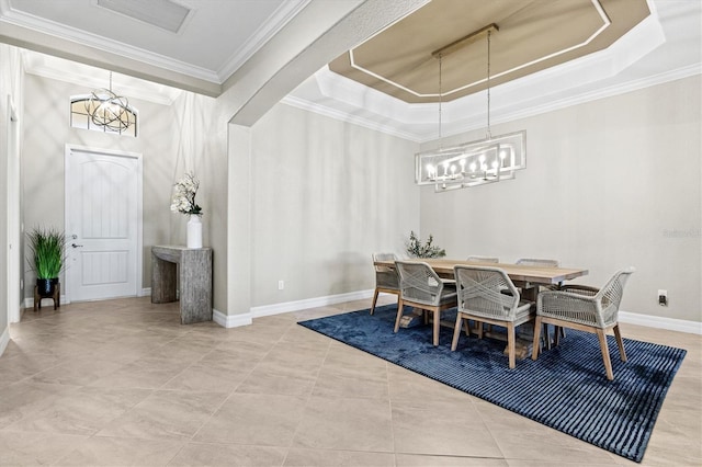 dining room featuring arched walkways, a tray ceiling, crown molding, and an inviting chandelier