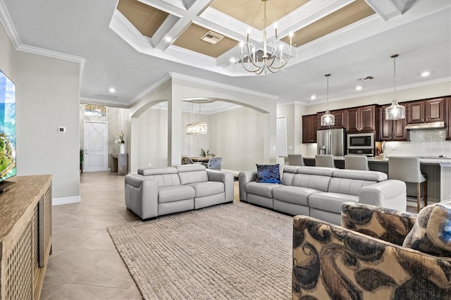 living room featuring light tile patterned floors, visible vents, arched walkways, crown molding, and a notable chandelier