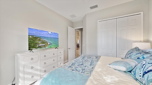 bedroom featuring a closet and visible vents