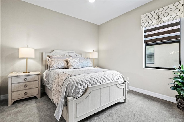 bedroom featuring dark colored carpet