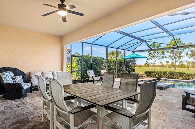 view of patio / terrace featuring an outdoor living space, a lanai, and ceiling fan