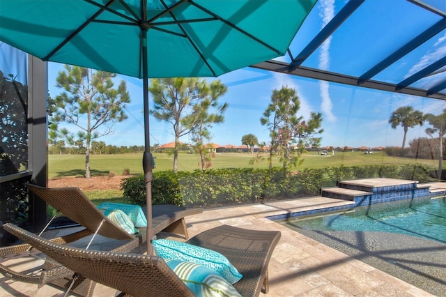 pool featuring a patio area and glass enclosure