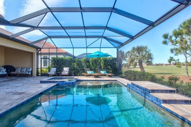 view of swimming pool with a patio, a lanai, and a pool with connected hot tub