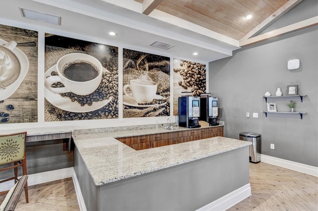 bar with lofted ceiling, sink, wood ceiling, light stone countertops, and light parquet floors