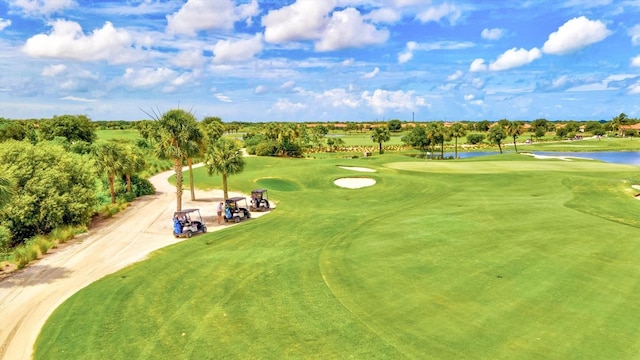 birds eye view of property with view of golf course