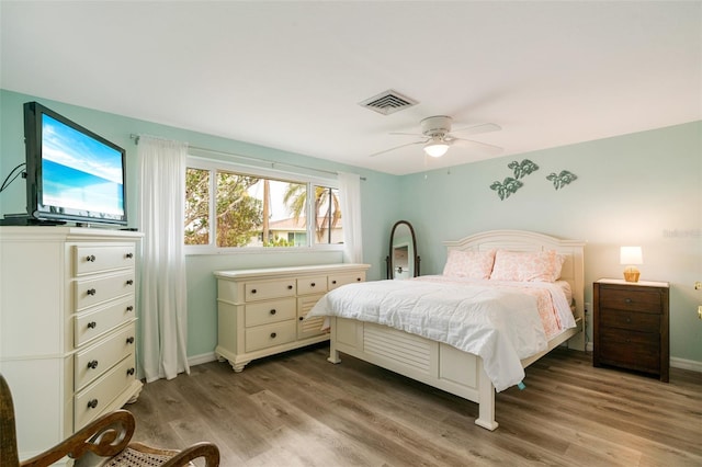 bedroom featuring ceiling fan and light wood-type flooring