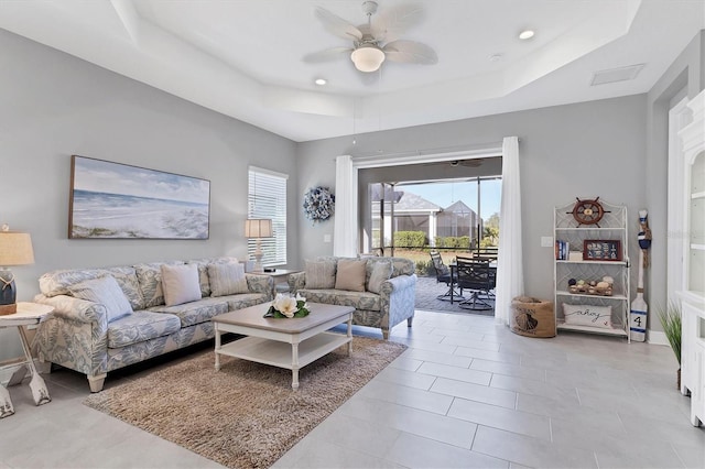 12488 Palatka Dr, Venice, FL 34293 - living room featuring a tray ceiling and ceiling fan