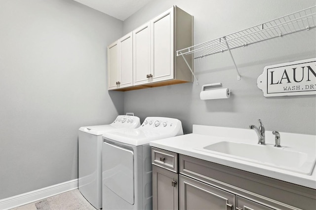 12488 Palatka Dr, Venice, FL 34293 - clothes washing area with cabinets, separate washer and dryer, and sink