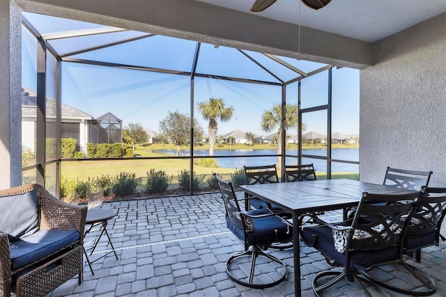 12488 Palatka Dr, Venice, FL 34293 - view of patio with a water view, ceiling fan, and a lanai