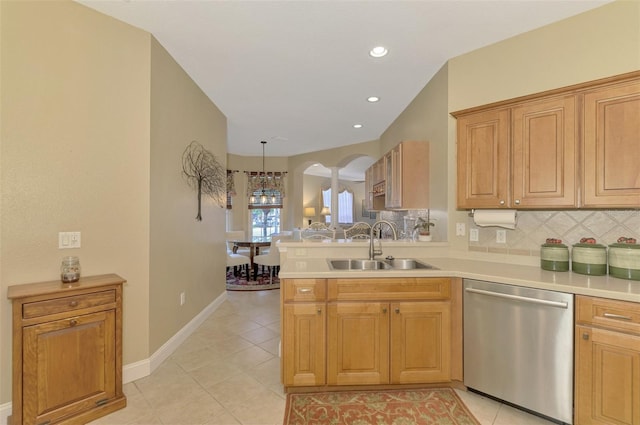 kitchen with dishwasher, decorative light fixtures, tasteful backsplash, sink, and kitchen peninsula